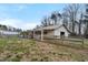 Large barn with a covered area and fenced enclosure at 4811 New Sharon Church Rd, Hillsborough, NC 27278