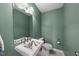 Powder room featuring unique floral sink, ample lighting and neutral paint colors at 4811 New Sharon Church Rd, Hillsborough, NC 27278