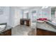 Bathroom featuring tiled floors, vanity, and a mirror with sconces at 4811 New Sharon Church Rd, Hillsborough, NC 27278