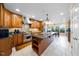Spacious kitchen featuring wooden cabinetry, stainless steel appliances, and large island at 4811 New Sharon Church Rd, Hillsborough, NC 27278