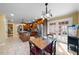 Eat-in kitchen with wood table, stainless appliances, and access to outdoor patio at 4811 New Sharon Church Rd, Hillsborough, NC 27278