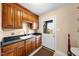Laundry room with plenty of storage space, granite countertops, and a sink at 4811 New Sharon Church Rd, Hillsborough, NC 27278