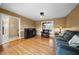 Comfortable living room with hardwood floors, fireplace, and a cozy sitting area at 4811 New Sharon Church Rd, Hillsborough, NC 27278