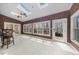 Bright sunroom with brick accent walls, skylights and floor-to-ceiling windows at 4811 New Sharon Church Rd, Hillsborough, NC 27278