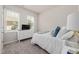 Bedroom features a white bed, white dresser, plush carpet, and a large window with natural light at 508 Sweet Pine Ln, Knightdale, NC 27545