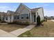 Charming home with blue shutters, brick accents, and well-manicured landscaping at 508 Sweet Pine Ln, Knightdale, NC 27545