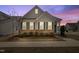 Charming single-story home with brick accents, well-manicured lawn, and inviting curb appeal at twilight at 508 Sweet Pine Ln, Knightdale, NC 27545