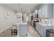 Bright kitchen featuring an island with seating, stainless appliances and stylish modern design at 508 Sweet Pine Ln, Knightdale, NC 27545