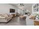 Bright and airy living room with hardwood floors, comfortable seating, and a modern entertainment setup at 508 Sweet Pine Ln, Knightdale, NC 27545