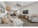 Open-concept living room featuring stylish decor, hardwood floors, and ample natural light at 508 Sweet Pine Ln, Knightdale, NC 27545