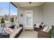Cozy screened-in porch with comfortable seating and charming string lights at 508 Sweet Pine Ln, Knightdale, NC 27545
