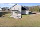 Spacious backyard featuring a custom stone fire pit and well-maintained lawn at 54 Silverleaf Dr, Wendell, NC 27591