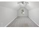 Bright bedroom featuring neutral walls, gray carpet, and a window for natural light at 54 Silverleaf Dr, Wendell, NC 27591