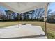 Covered patio with open view of backyard featuring a stone fire pit at 54 Silverleaf Dr, Wendell, NC 27591