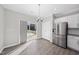 Bright dining area with sliding glass doors leading to the backyard and stainless steel refrigerator at 54 Silverleaf Dr, Wendell, NC 27591