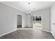 Inviting dining area with sliding doors to the backyard and a view into the laundry area at 54 Silverleaf Dr, Wendell, NC 27591