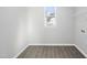 Laundry room featuring vinyl floors, a window, a wire shelf, and washer and dryer hookups at 54 Silverleaf Dr, Wendell, NC 27591