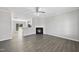 Bright living room featuring vinyl plank flooring and a fireplace at 54 Silverleaf Dr, Wendell, NC 27591