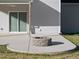 View of the outdoor patio area with a stone fire pit, ideal for relaxation at 54 Silverleaf Dr, Wendell, NC 27591