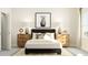 Bright bedroom with soft lighting, comfortable bed, stylish lamps and bedside tables at 5640 Cayden Cove Dr, Wendell, NC 27591