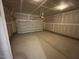 This garage has an automatic garage door and bare drywall at 5640 Cayden Cove Dr, Wendell, NC 27591