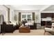 Comfortable living room with a large sectional sofa, stylish decor, and an open view into the modern kitchen at 5640 Cayden Cove Dr, Wendell, NC 27591