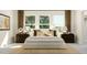 Serene bedroom with ample natural light, a cozy bed, and stylish decor creating a restful retreat at 5640 Cayden Cove Dr, Wendell, NC 27591