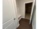 This mudroom has a bench with hooks and hardwood floors at 5640 Cayden Cove Dr, Wendell, NC 27591