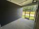 This screened patio has wood paneled walls, a concrete floor, and screens at 5640 Cayden Cove Dr, Wendell, NC 27591