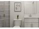 Contemporary bathroom featuring sleek vanity, modern fixtures, and framed art at 5645 Cayden Cove Dr, Wendell, NC 27591