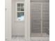 Bright bathroom showcasing a modern shower with glass door and sleek gray tiling at 5645 Cayden Cove Dr, Wendell, NC 27591