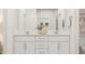 Bright bathroom featuring double vanity, modern fixtures, and an indoor plant at 5645 Cayden Cove Dr, Wendell, NC 27591