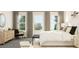Bright and airy bedroom with three large windows and contemporary furnishings at 5645 Cayden Cove Dr, Wendell, NC 27591