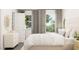 Bright bedroom with a stylish bed, bedside tables, modern decor, and natural light at 5645 Cayden Cove Dr, Wendell, NC 27591