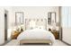 Bright bedroom featuring a neutral color palette, stylish nightstands and modern wall mirrors at 5645 Cayden Cove Dr, Wendell, NC 27591