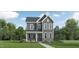 Charming two-story home with stone accents and a welcoming front porch, perfect for Gathering living at 5645 Cayden Cove Dr, Wendell, NC 27591