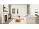 Cozy living room featuring a fireplace, large windows, and comfortable seating for relaxing and entertaining at 5645 Cayden Cove Dr, Wendell, NC 27591
