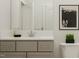 Cozy bathroom with neutral palette, vanity, mirror, and framed art, creating a stylish and functional space at 5648 Cayden Cove Dr, Wendell, NC 27591