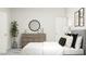 Contemporary bedroom boasts stylish furnishings, natural light, and cozy textures for a serene and inviting atmosphere at 5648 Cayden Cove Dr, Wendell, NC 27591