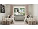 Charming bedroom with twin beds, soft lighting, and decor creating a cozy retreat for rest and relaxation at 5648 Cayden Cove Dr, Wendell, NC 27591