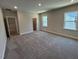 Spacious bedroom with two windows, wall to wall carpeting, and neutral paint at 5648 Cayden Cove Dr, Wendell, NC 27591