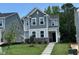 Charming two-story home with stone accents and well-maintained landscaping and covered front entryway at 5648 Cayden Cove Dr, Wendell, NC 27591