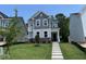 Charming two-story home with stone accents and well-maintained landscaping and covered front entryway at 5648 Cayden Cove Dr, Wendell, NC 27591