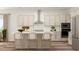 Modern kitchen island with pendant lighting and stainless steel appliances at 5648 Cayden Cove Dr, Wendell, NC 27591