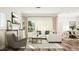 Bright and airy living room with hardwood floors and comfortable seating at 5648 Cayden Cove Dr, Wendell, NC 27591