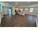 Spacious open concept living and kitchen area with hardwood floors and recessed lighting throughout at 5648 Cayden Cove Dr, Wendell, NC 27591