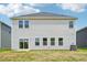 Exterior back of house with sliding glass door and series of windows at 571 White Birch Ln, Angier, NC 27501