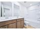 Modern bathroom showcasing a double vanity, soaking tub, and shower at 571 White Birch Ln, Angier, NC 27501
