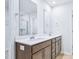 Bright bathroom features double sinks and vanities at 571 White Birch Ln, Angier, NC 27501