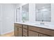 Bright bathroom features double sinks and a walk-in shower at 571 White Birch Ln, Angier, NC 27501